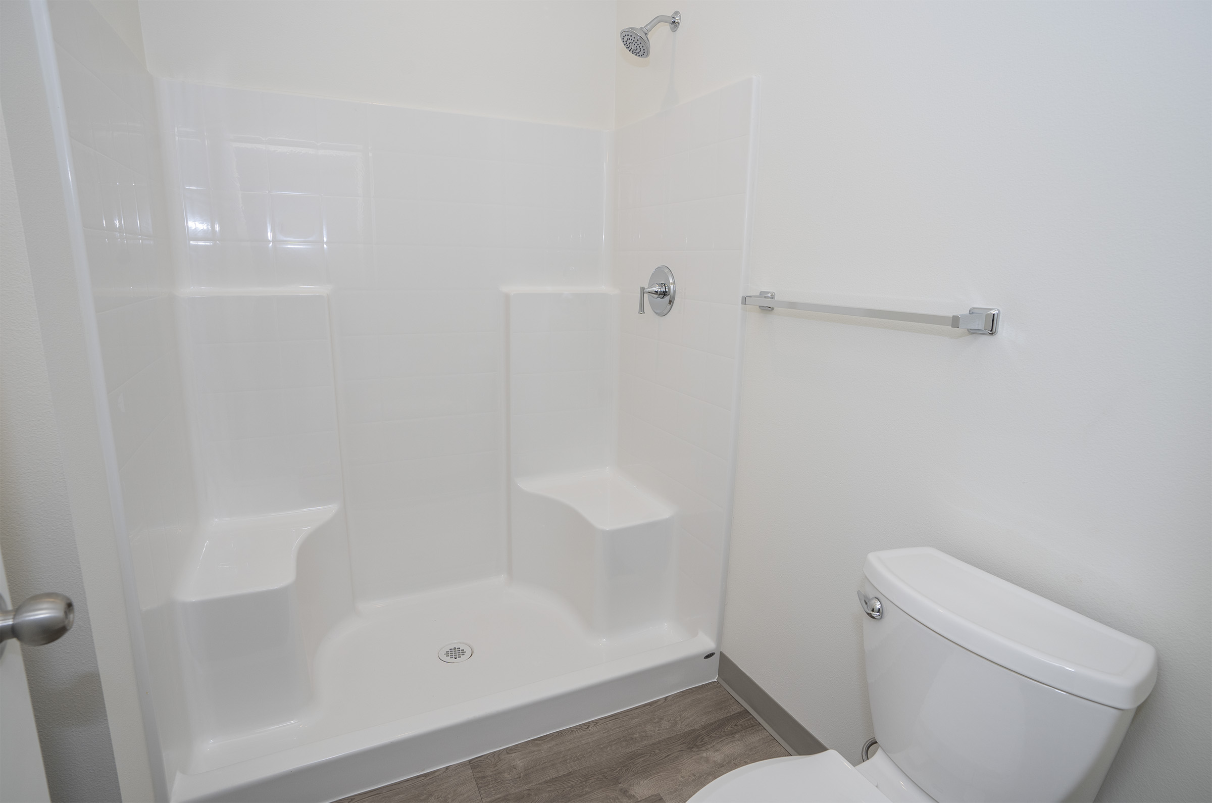Bathroom with walk-in shower and built-in seat — One-12 Townhomes Lakewood WA